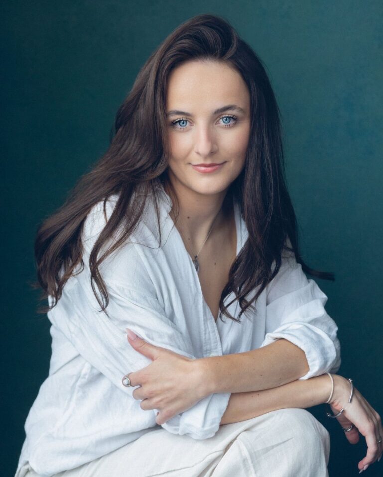 Headshot of Molly Penniston, in a white shirt.